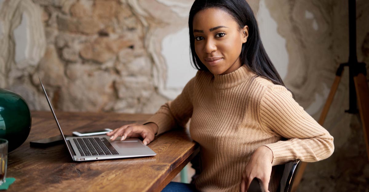Young Black female Screenwriting writing a script