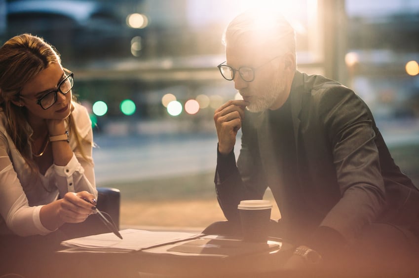 Line Producer running through the budget with an older film development executive