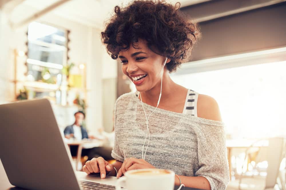 Script Reader smiling and reading script on her laptop