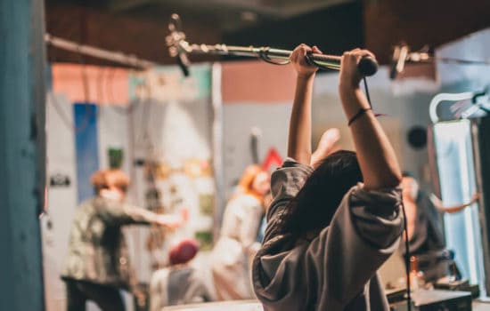 Film production sound team with boom operator